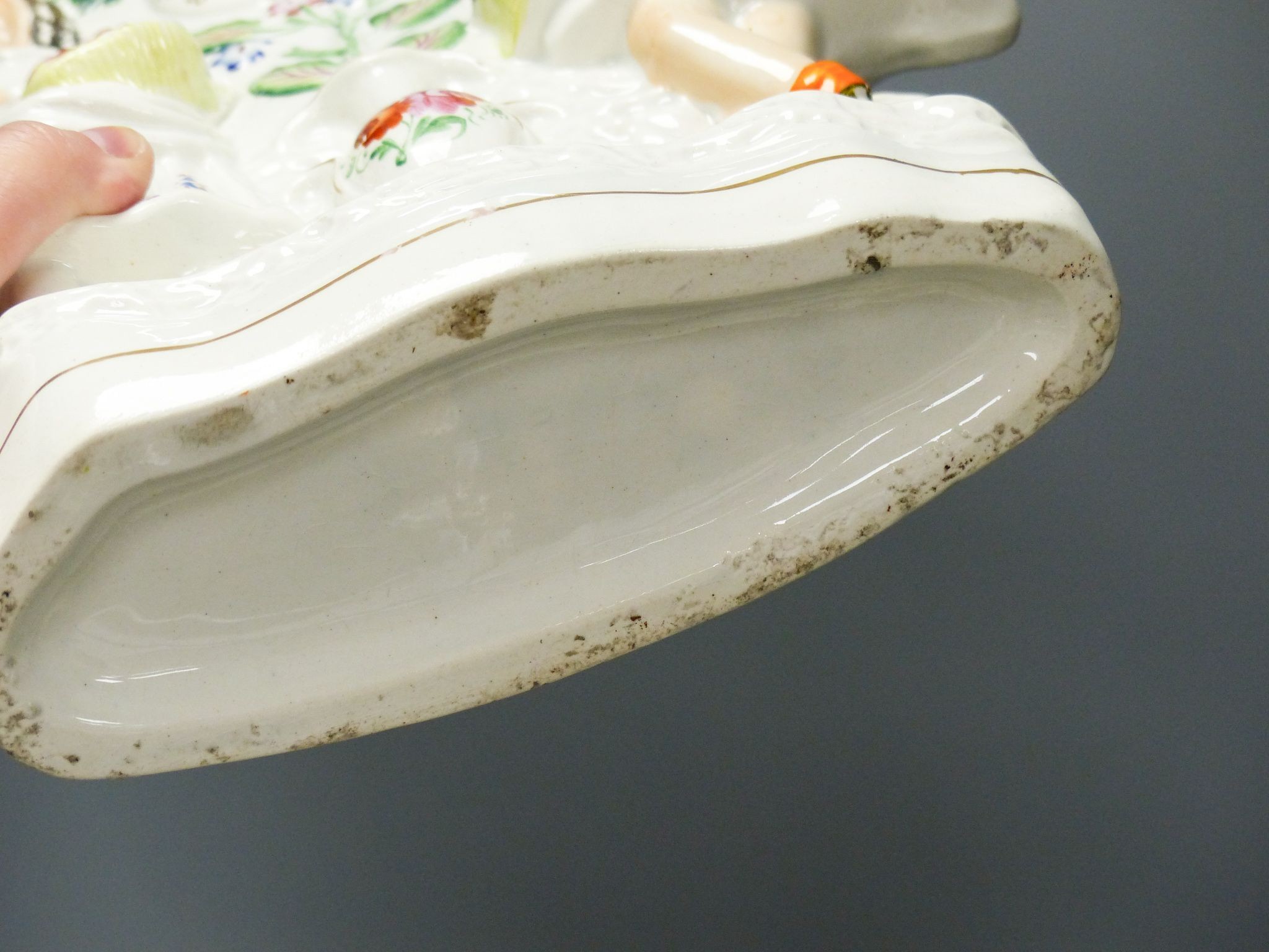 A pair of 19th century Staffordshire cow groups and a similar flatback, tallest 33 cm